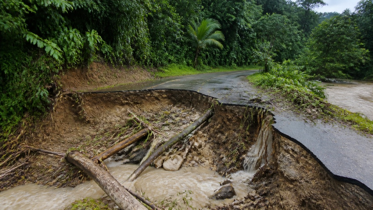 collapsed rural tropical road after heavy rain in Bocas del Toro, no people