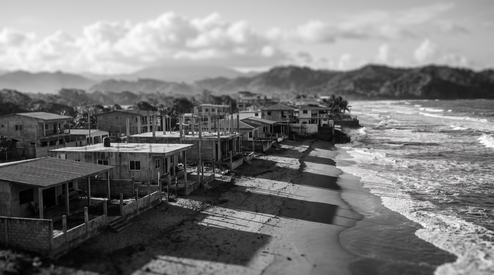 An open stretch of Pacific coastline beside a growing residential district.