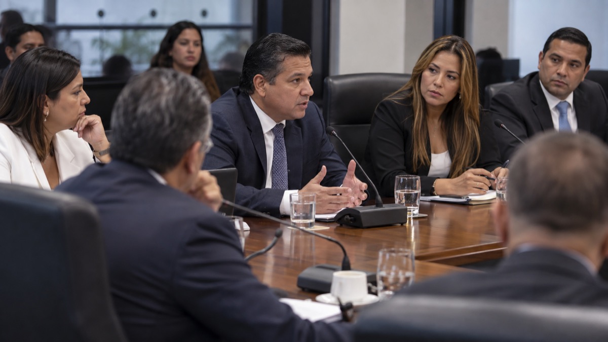 neutral Panama political discussion in a legislative committee room with generic officials, no flags, no public-figure likeness or text
