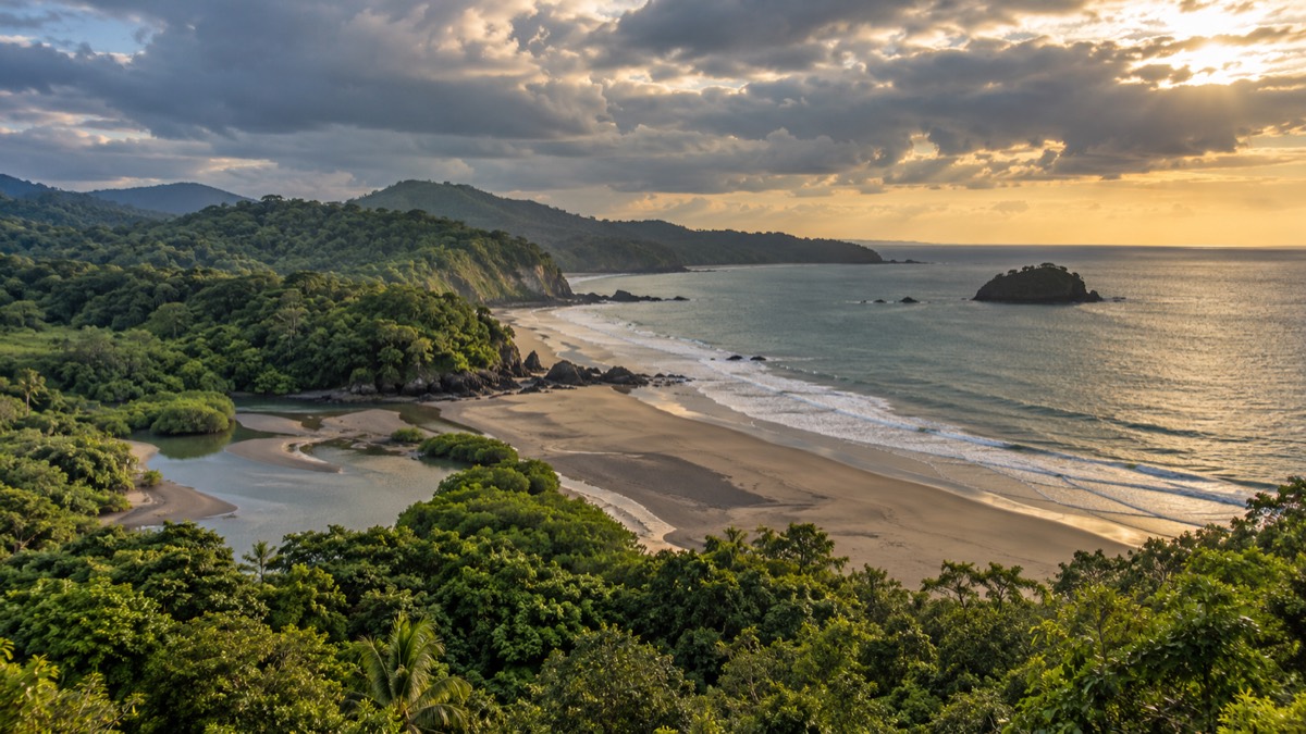 Illustrative AI-generated view of a forested beach and estuary on Panama's Pacific coast of Veraguas.